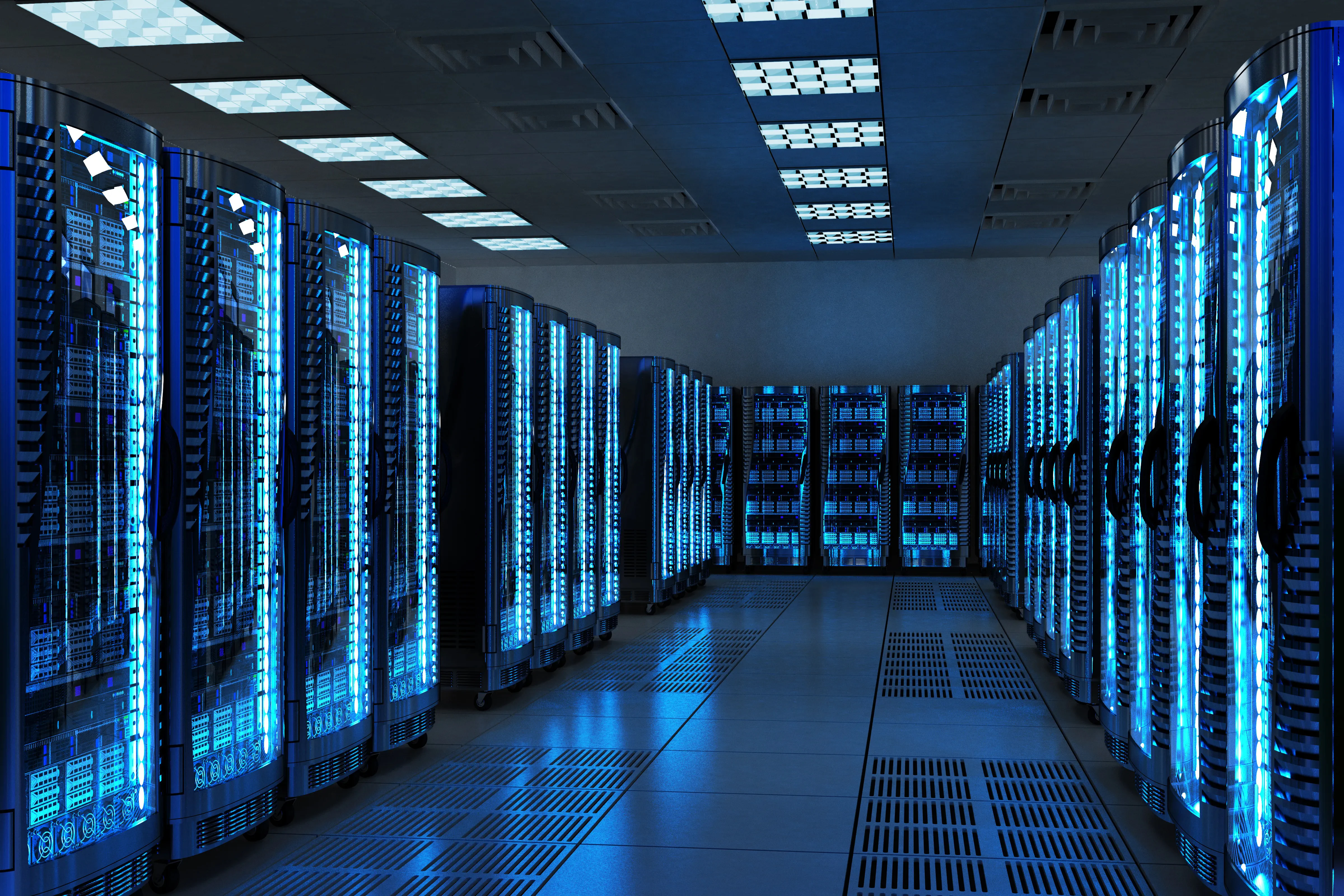 racks of computers in a data center with blue lighting